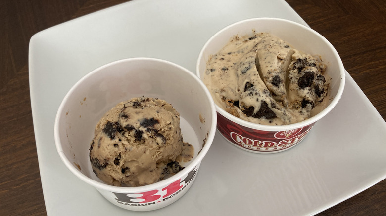 Scoops of coffee cookies and cream ice cream in paper cups from Cold Stone and Baskin-Robbins