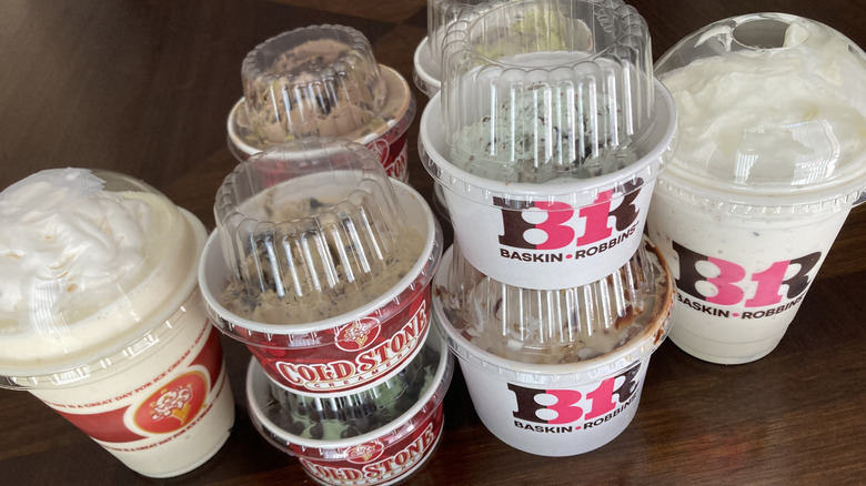 Cold Stone and Baskin-Robbins stacks of paper cups with scoops of ice cream and to-go cups of shakes