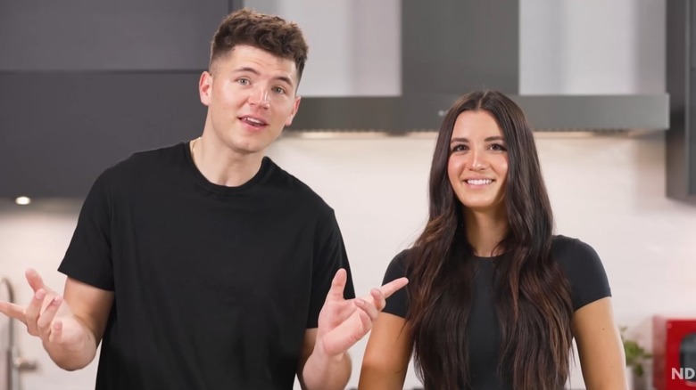 Nick DiGiovanni and Isabelle Tashima filming for a cooking challenge video