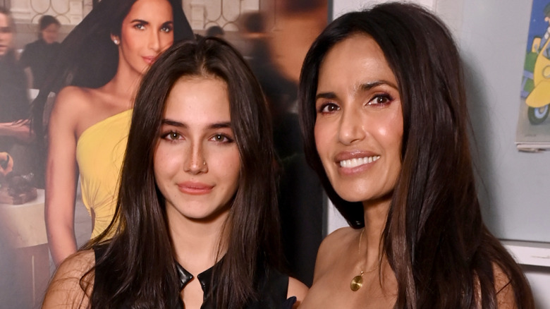 Padma Lakshmi and her daughter Krishna posing for pictures at a premiere.