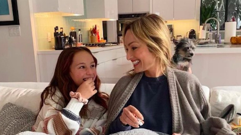 Giada De Laurentiis and daughter snuggle on couch