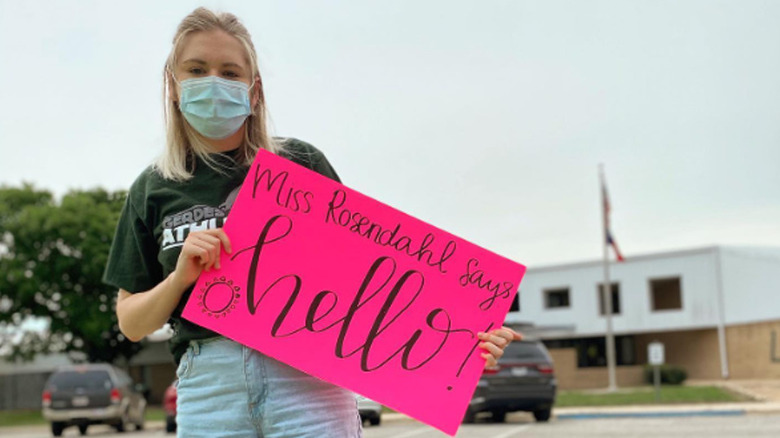 Kate Weissman standing outside school