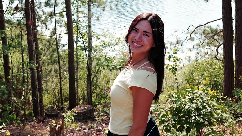 Haley Pham posing for a photo in the woods