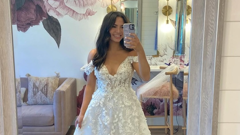 Mirror selfie of Haley Pham in her wedding dress