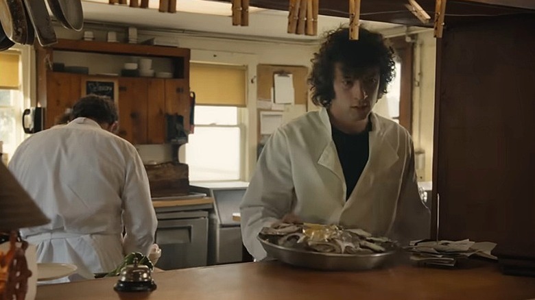 Dominic Sessa in a kitchen as a young Anthony Bourdain in the film Tony