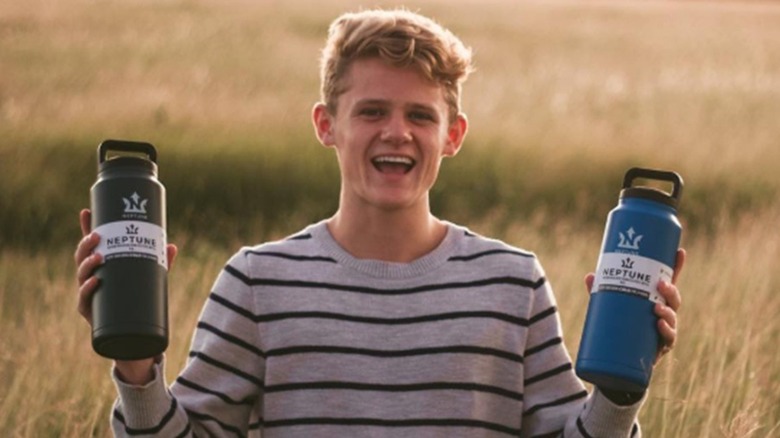 Ryan Trahan with Neptune bottles
