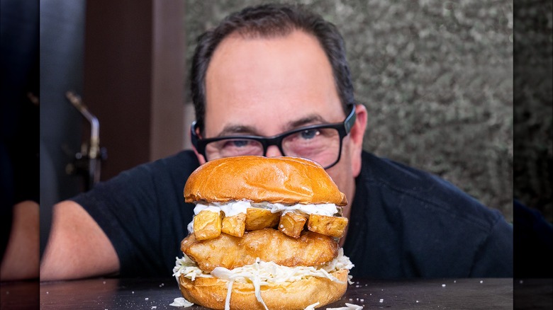 Sam Zien with a fish and chips sandwich