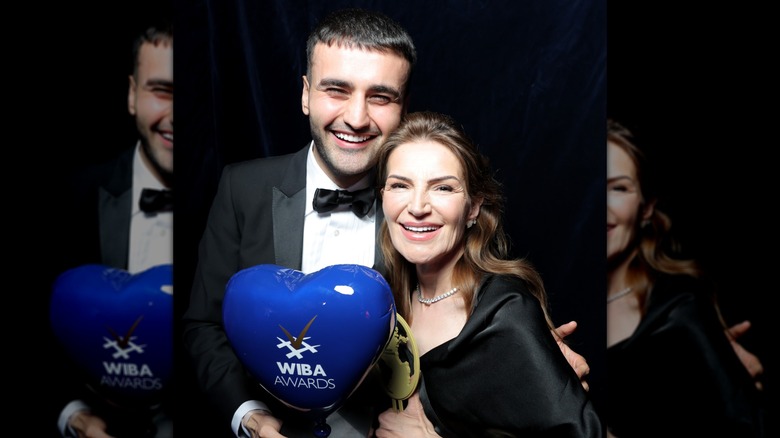 CZN Burak, real name Burak Özdemir, posing with his mother after winning the Grand Prix WIBA Award in 2024