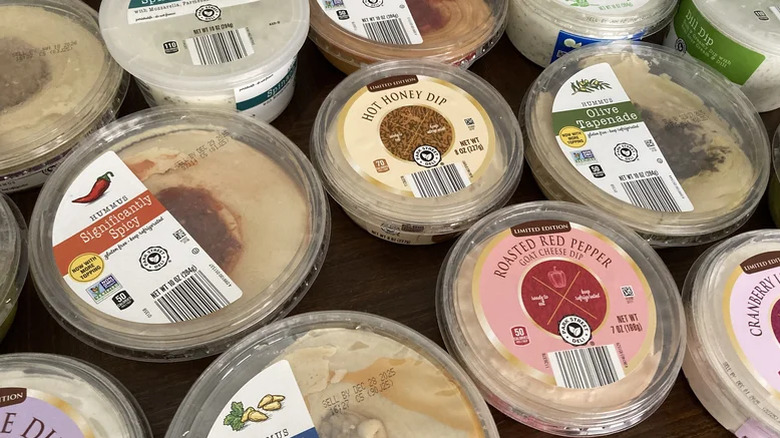 Various tubs of Aldi's Park Street Deli-branded dips and spreads