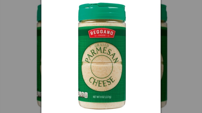 Aldi's Reggano grated parmesan and romano cheese against white background.