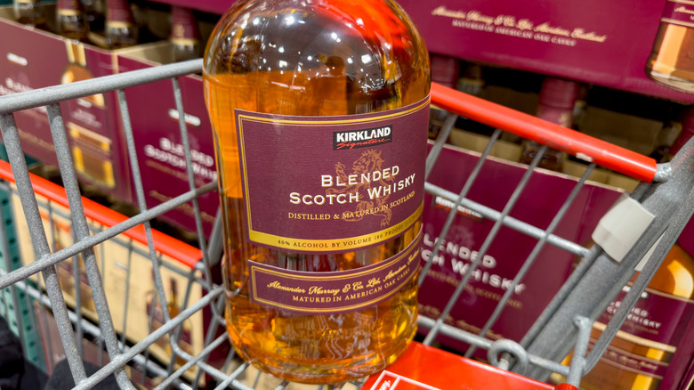 A bottle of Kirkland Signature blended Scotch whisky in Costco shopping cart