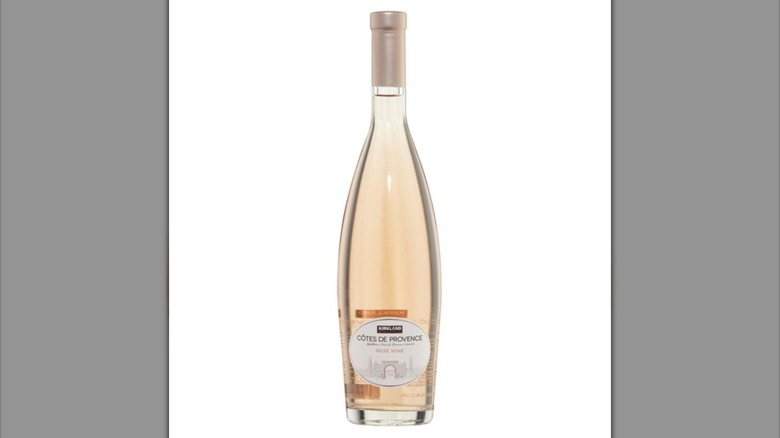 Bottle of Kirkland Signature Côtes de Provence rosé wine against white background.