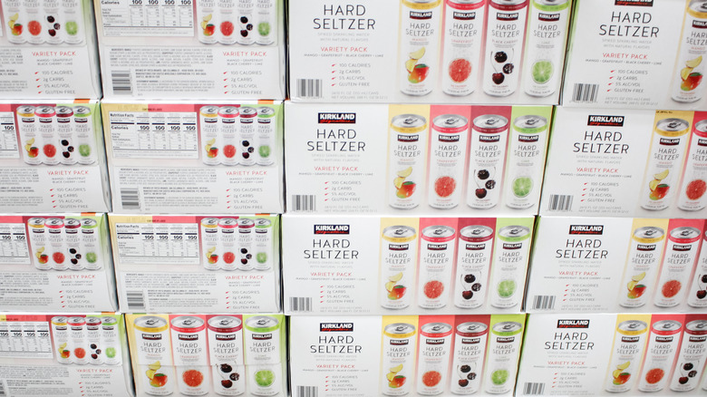 Stacks of Costco Kirkland Signature hard seltzer in warehouse.