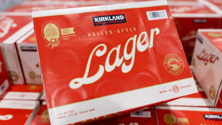 Box of Kirkland Signature Lager on large stack.