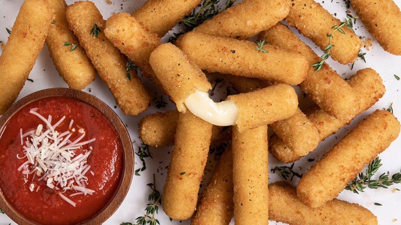 Sam's Club Member's Mark frozen breaded mozzarella sticks with sauce.