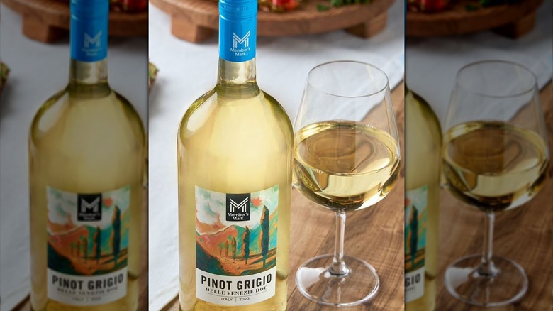 Bottle and glass of Member's Mark pinot grigio in kitchen.