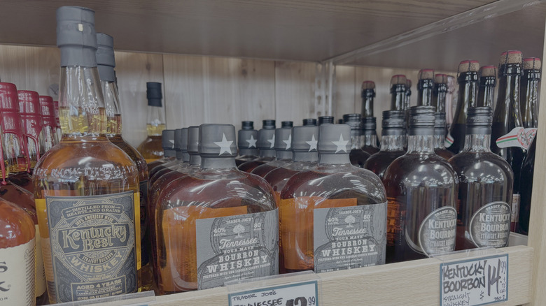 Trader Joe's Kentucky Best bourbon, Tennessee Sour Mash Bourbon, and Kentucky Bourbon on a shelf