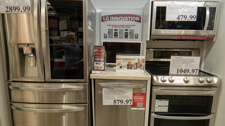 LG refrigerator, dishwasher, and stove on display at store