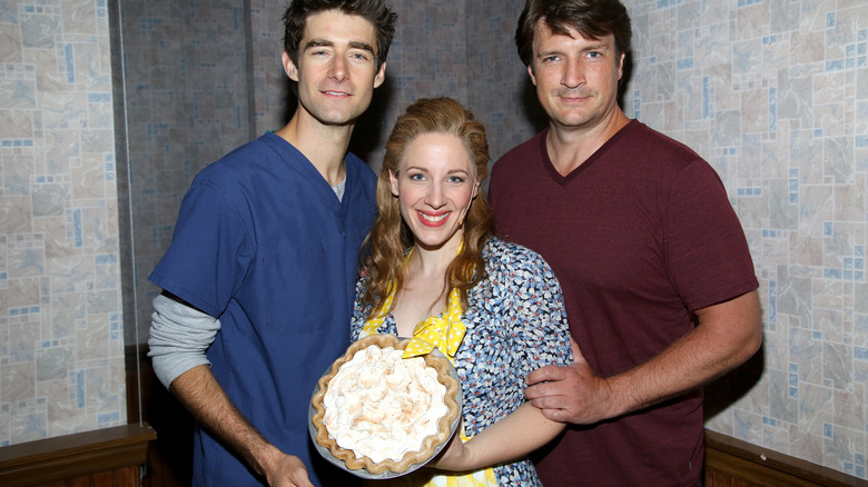 Actors of Broadway's "Waitress" holding a pie