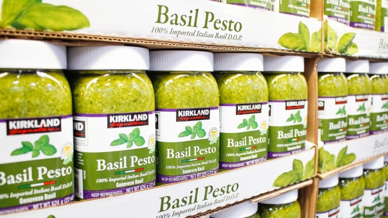 Kirkland Signature basil pesto jars on a shelf in Costco