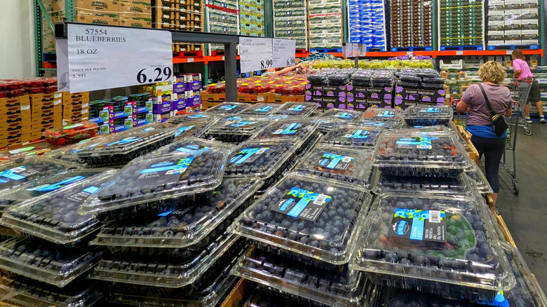 Packages of blueberries on display in Costco.