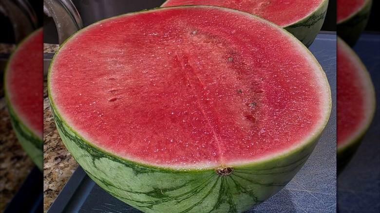 Halved mini watermelons from Costco on a cutting board