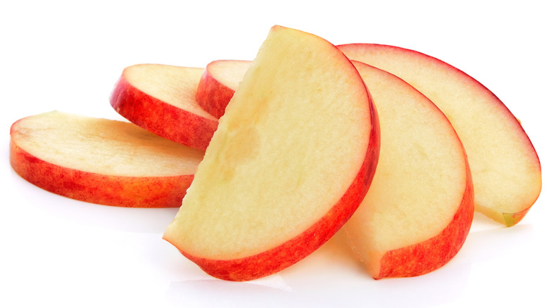 Apple slices on white background