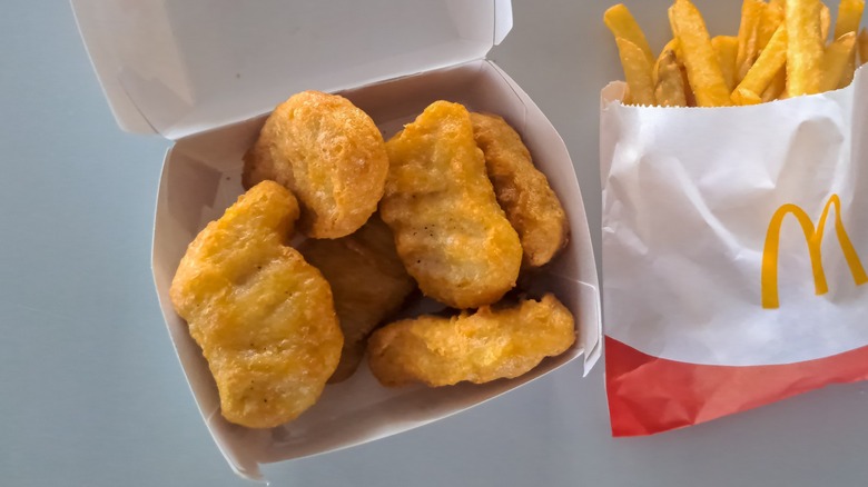 Top view of an open box of McDonald's chicken McNuggets and fries