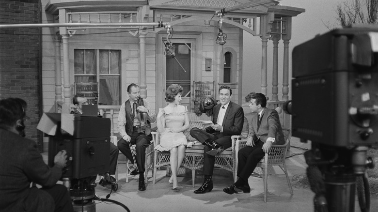 Black and white, behind the scenes photo of Jimmy Dean hosting an episode of The Jimmy Dean Show