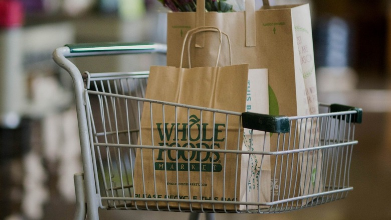 cart with Whole Foods bags