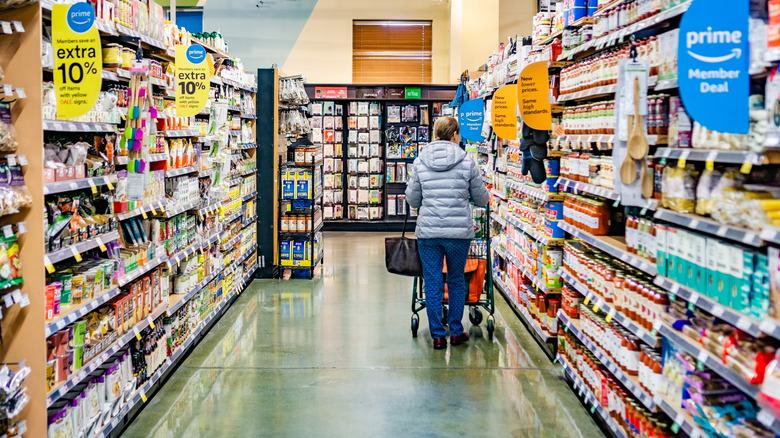 Shopper in Whole Foods aisle