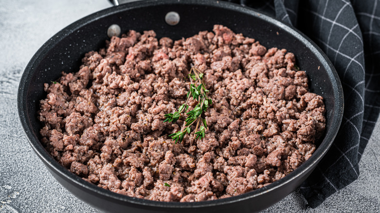 Cooked ground beef in skillet