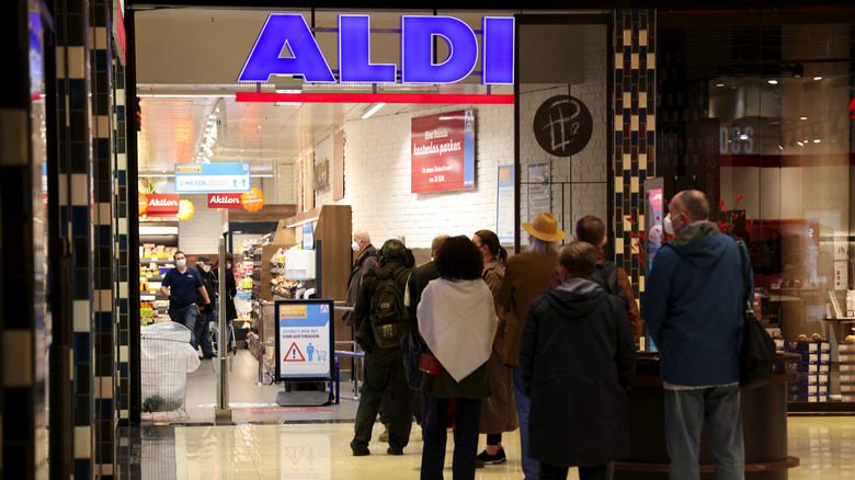 shoppers in line outside Aldi