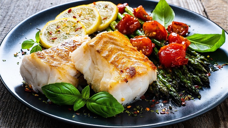 Fish filet with tomatoes and basil