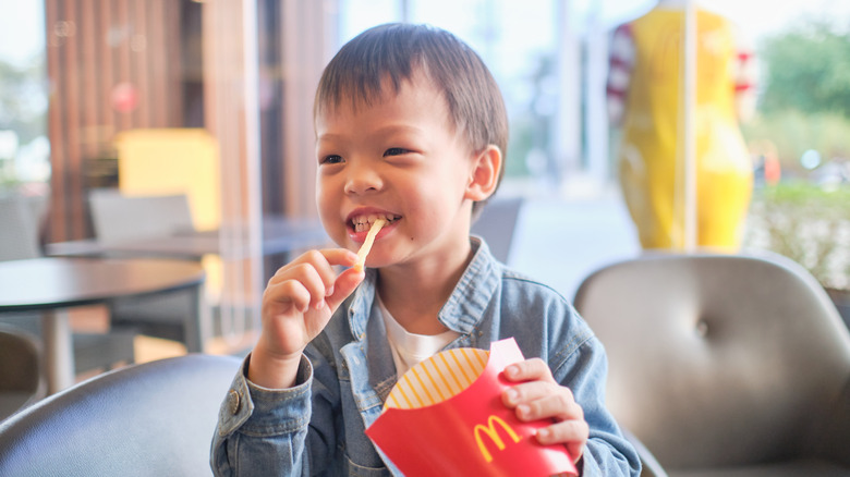 Toddler eating McDonald's fries