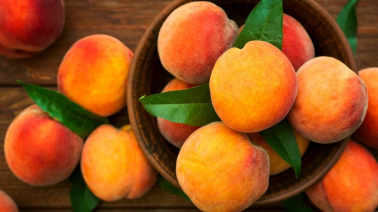 Peaches on wooden table