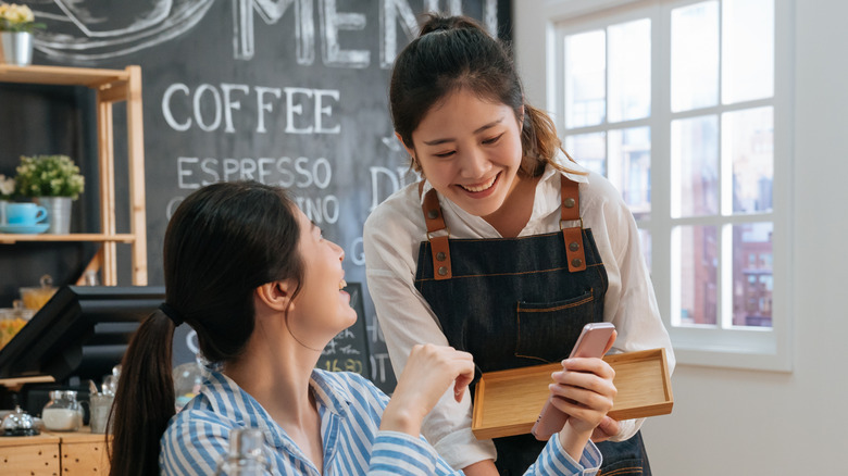 Restaurant server and customer