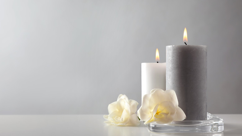 Scented candle on gray background