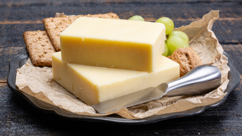 sharp cheddar on plate with crackers