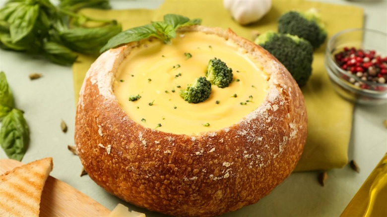 Broccoli cheddar soup served in a bread bowl