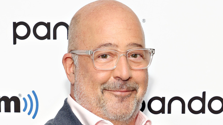 Andrew Zimmern wearing glasses