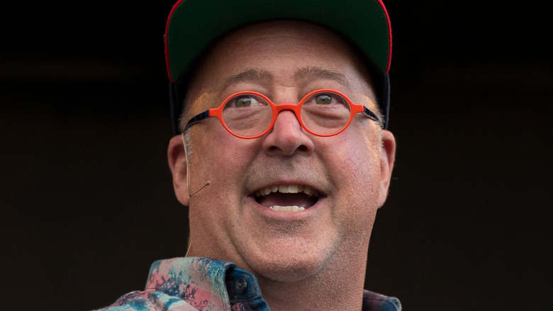 Andrew Zimmern talking and smiling