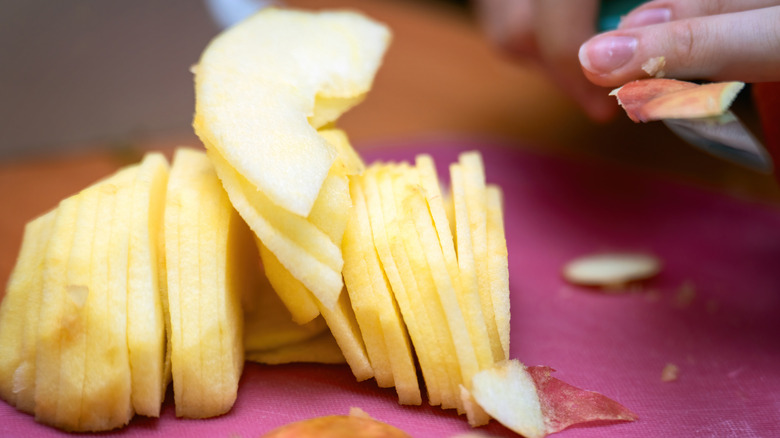 Sliced apples on a cutting board