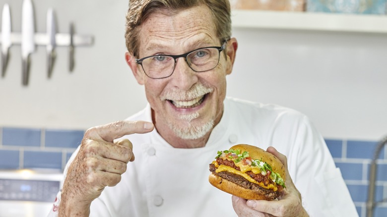 Rick Bayless with a burger