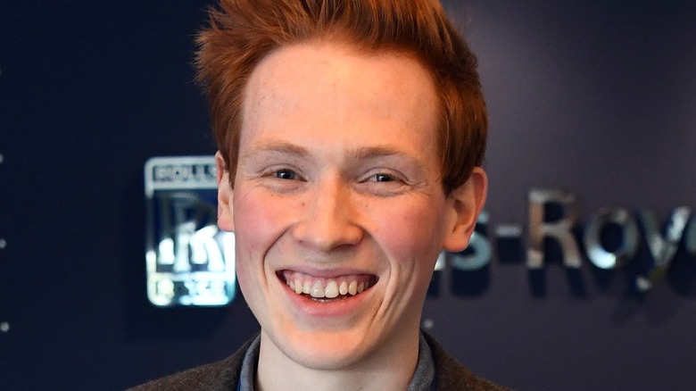 andrew smyth smiles with hair spiked up