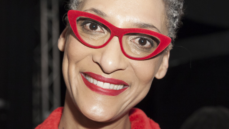 Carla Hall wearing red glasses