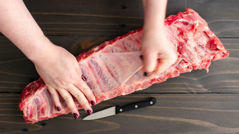 Removing the membrane from ribs