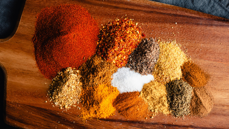 A spice blend on a wooden cutting board