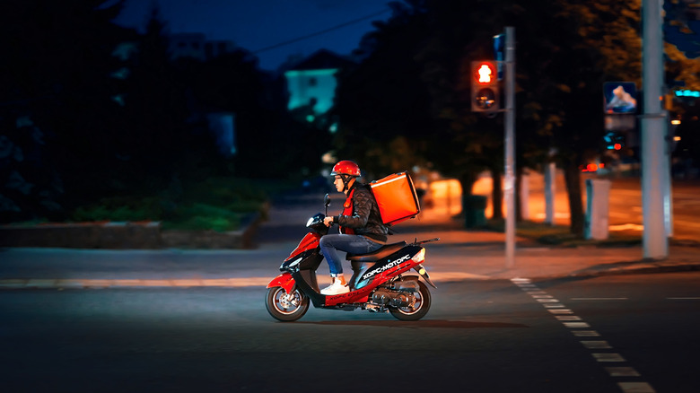 Delivery boy on bike