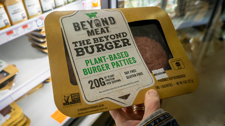 customer holding beyond burger